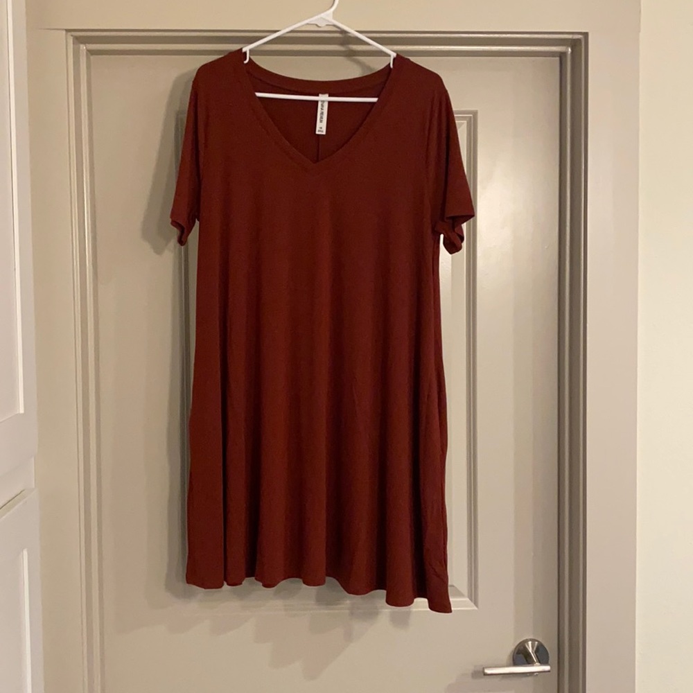 Rust colored tunic top.